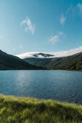 Mountain Capped with Clouds over Lake