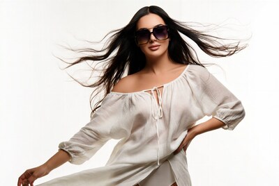 Woman with flowing hair and sunglasses