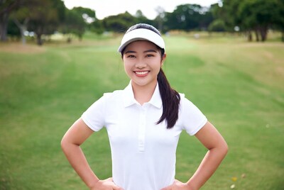 Asian woman golfer on green course
