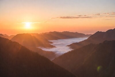 Sunrise over misty mountains