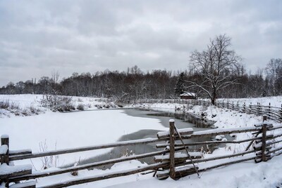 Snowy winter landscape with frozen river