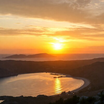 Sunset over bay with beach and islands