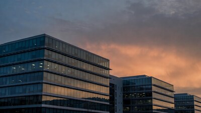 Glass office buildings at sunset