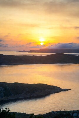 Sunset over coastal islands and sea