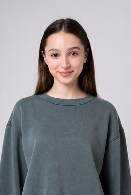 Young woman smiling in green hoodie
