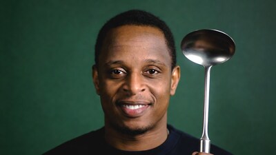 African-American man holding ladle