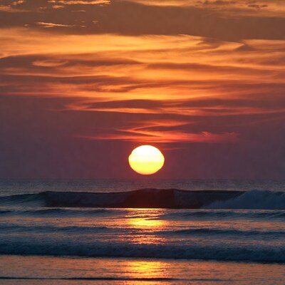 Sunset over ocean waves