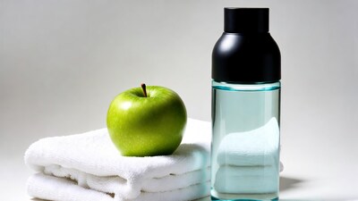 Green apple with water bottle towel