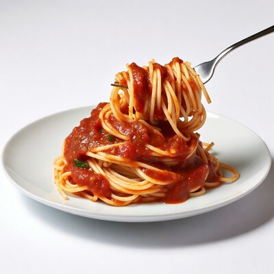 Spaghetti with fork on white plate