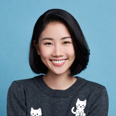 Asian woman smiling in cat sweater
