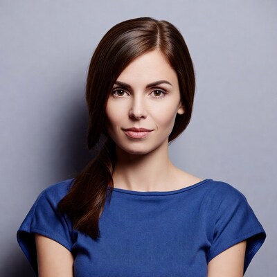 Woman with ponytail in blue top