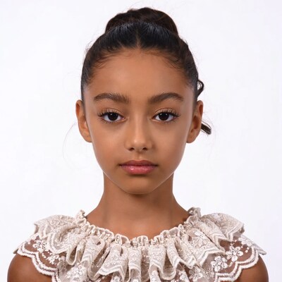 Young Black girl in lace collar