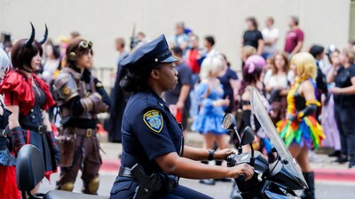 African-American woman police officer on motorcycle
