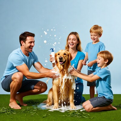 Family washing golden retriever dog