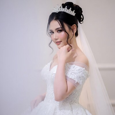 Asian bride in sparkling wedding gown