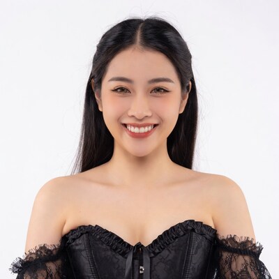 Asian woman smiling in black lace corset