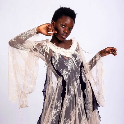 African-American girl in lace dress posing