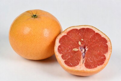 Whole and halved grapefruit