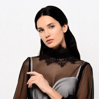 Woman in sheer lace blouse