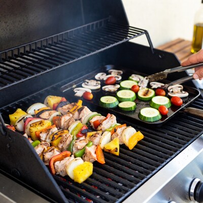 Grilling chicken skewers and veggies