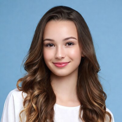 Smiling teenage girl with wavy brown hair