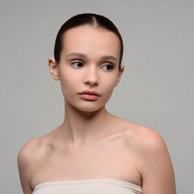 Young woman profile on gray background