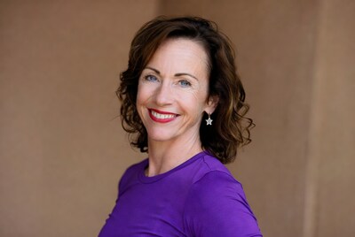 Smiling woman in purple top
