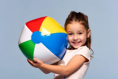 Girl holding colorful beach ball