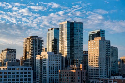 Modern skyscrapers under blue cloudy sky
