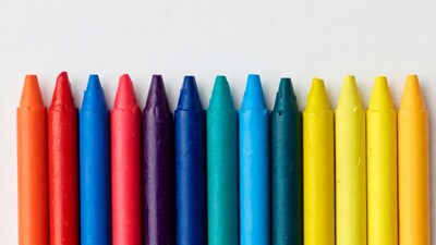 Colorful Crayons Lined Up on White