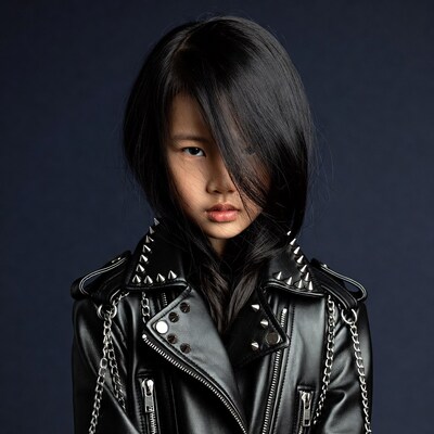 Asian girl in studded leather jacket