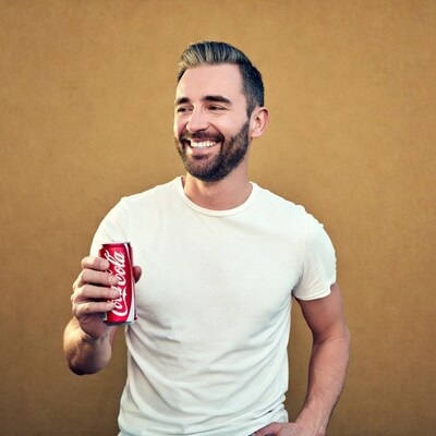 Man holding Coca-Cola can