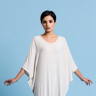 Latina woman in white dress arms outstretched