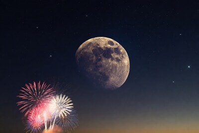 Fireworks and Moon in Night Sky