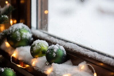 Snowy Green Christmas Ornaments on Windowsill