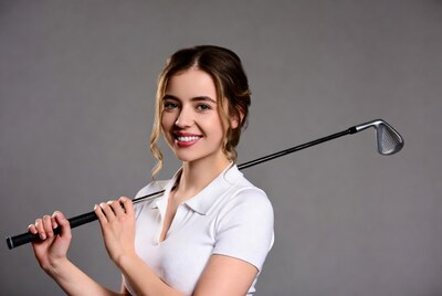 Smiling woman holding golf club