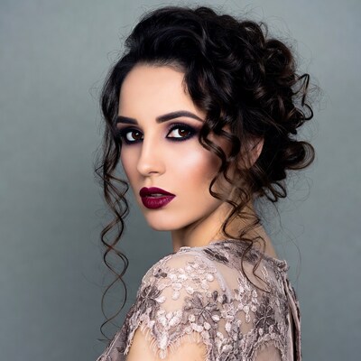 Woman with curly updo and red lips