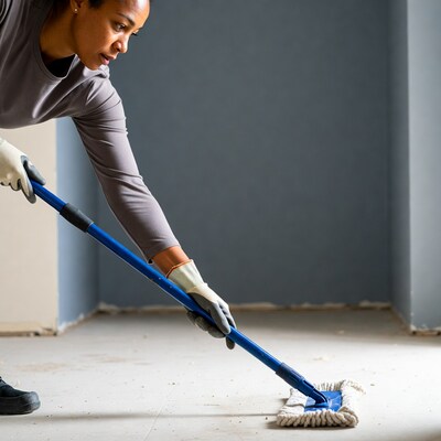 African-American woman mopping floor