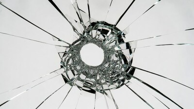 Bullet Hole in Shattered Glass