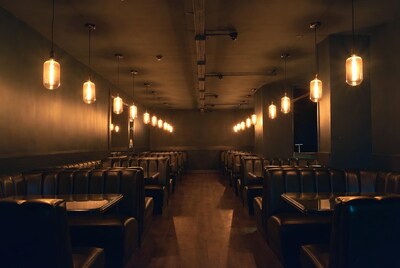 Empty modern restaurant with pendant lights