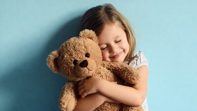 Girl hugging teddy bear