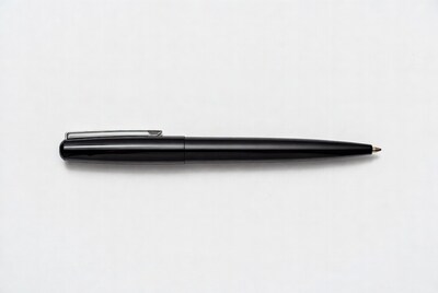 Black ballpoint pen on white background