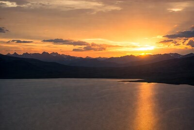 Sunset over mountains and lake
