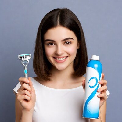 Young woman holding razor and shaving cream