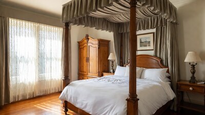 Elegant four-poster bed in luxury bedroom