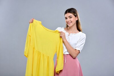 Woman holding yellow dress