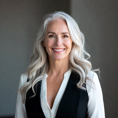 Smiling woman with long silver hair