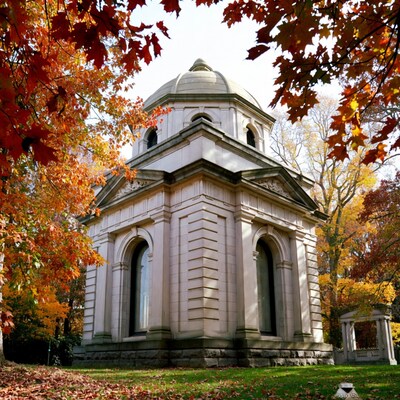 White Mausoleum Amid Autumn Foliage
