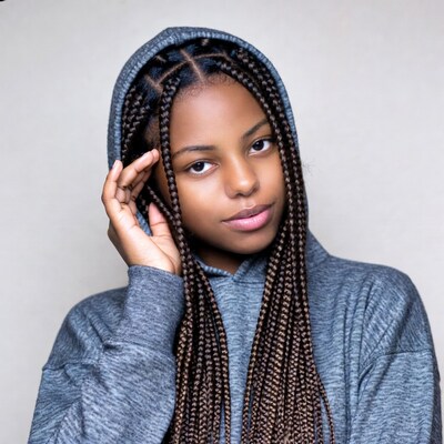 African-American girl in hoodie with braids