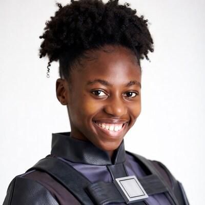 Smiling African-American girl in black leather outfit